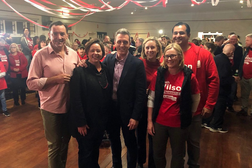John Wilson surrounded by supporters at Labor's by-election victory party in Fremantle.