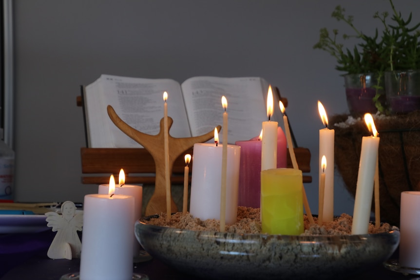 Burning candles on the table.