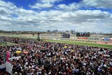 Thousands of racegoers enjoy the weather at Flemington racecourse on Melbourne Cup day in 2009