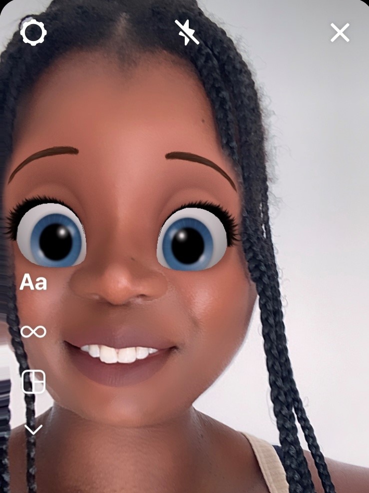 Screenshot of Santilla Chingaipe using a Disney beauty filter that makes her eyes big and blue on Instagram.