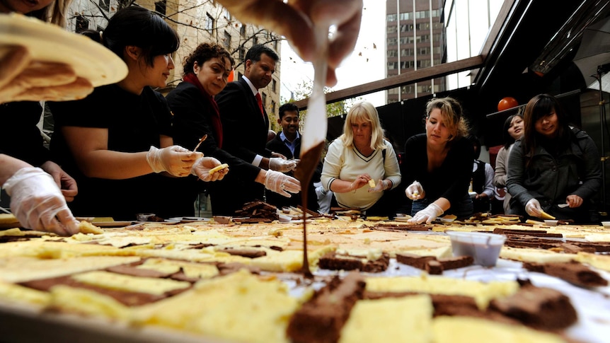 Chocolate lovers in Sydney helping in the celebration of the opening of a store in 2009.