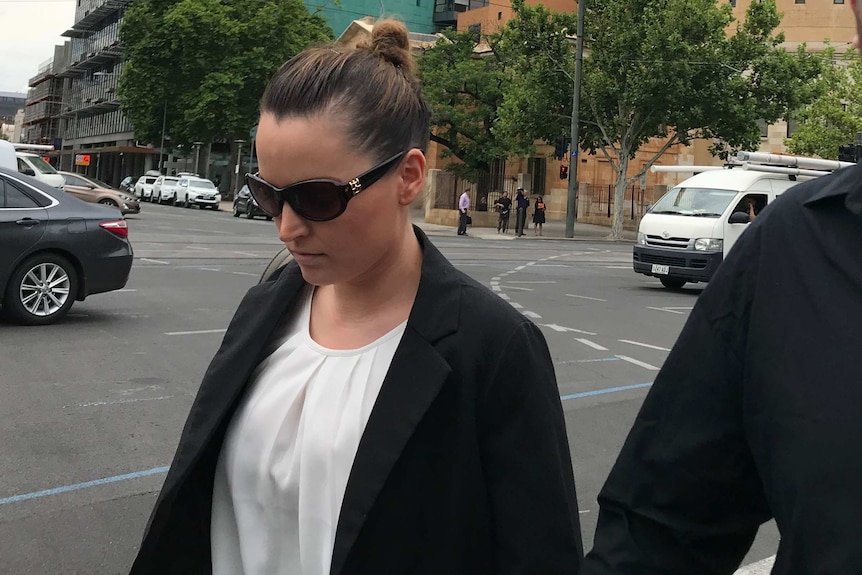 Jessica Cutting walks from the Adelaide coroners court