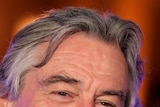 Robert De Niro smiles on the red carpet