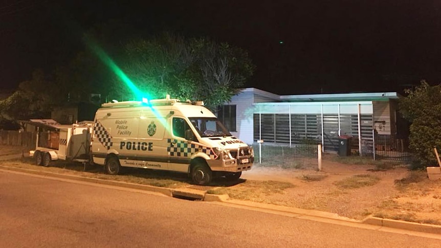 Police vehicle outside the home of Clare Alexa Wilson, then aged 92, at night in Mount Isa in April 2018