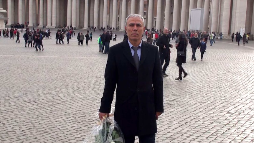 Pope John Paul II gunman Mehmet Ali Agca in surprise visit to the late pontiffs tomb in the Vatican on Dec 27, 2014