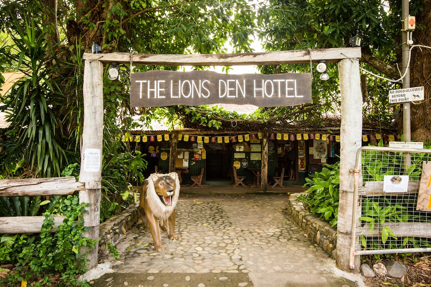 An outside view of the Lions Den hotel, including a fake lion