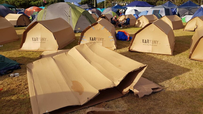 A rain-damaged cardboard tent.
