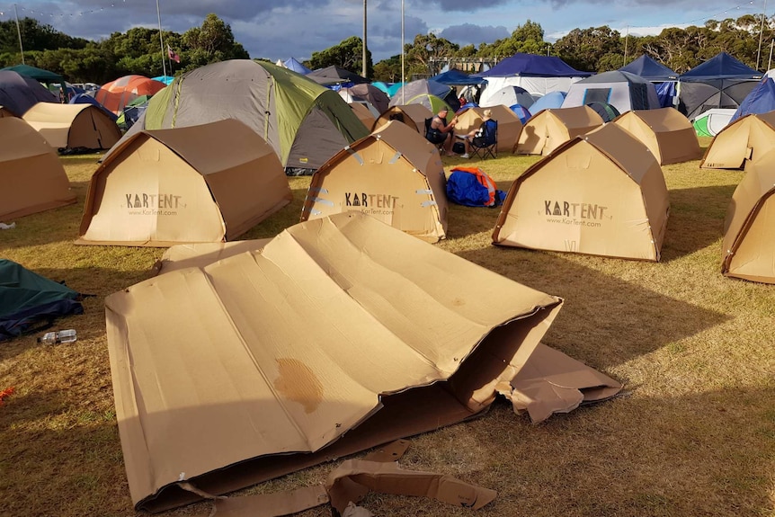 A rain-damaged cardboard tent.