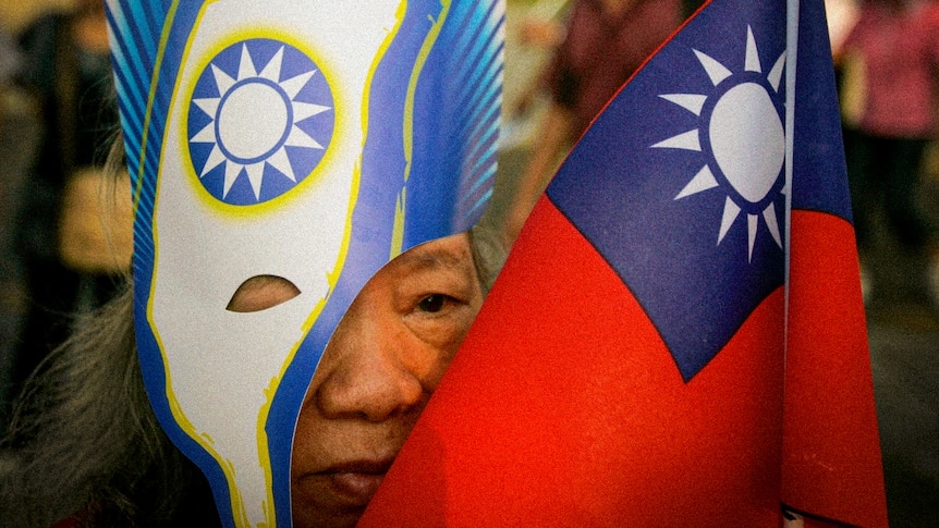 An older Taiwanese woman in a mask with 'Keep Going Taiwan' while her face is obscured by a Taiwanese mask