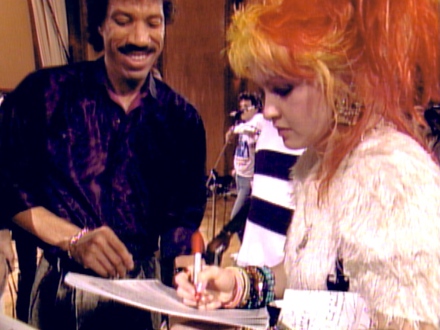 Lionel Richie and Cyndi Lauper recording We Are The World, January 1985 credit Netflix