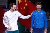 Roger Federer of Switzerland, left, gestures with Spain's Rafael Nadal.