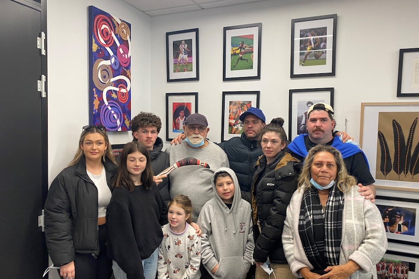 Robert Muir and his family inside St Kilda's Yawa room.