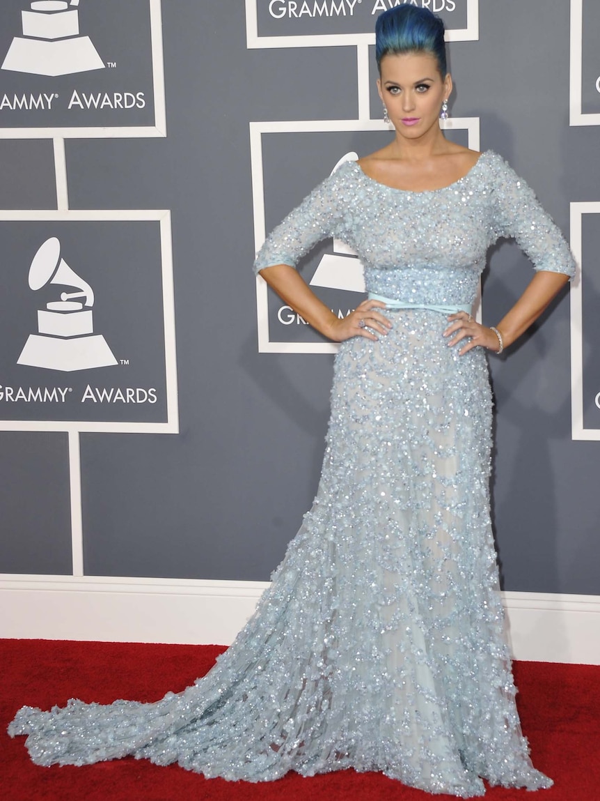 Katy Perry shows off her dress on the Grammys red carpet