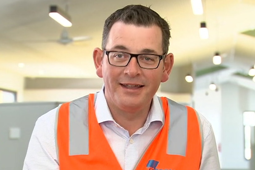 Daniel Andrews speaks to media inside a school which is under construction.