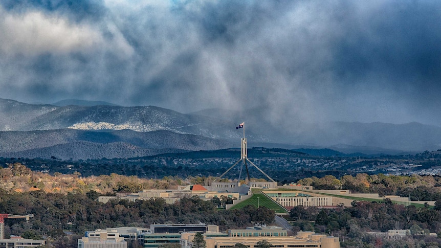 Snowy skies over Parliament House in Canberra.