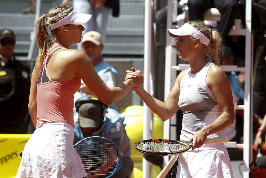 Caroline Wozniacki and Maria Sharapova shake hands
