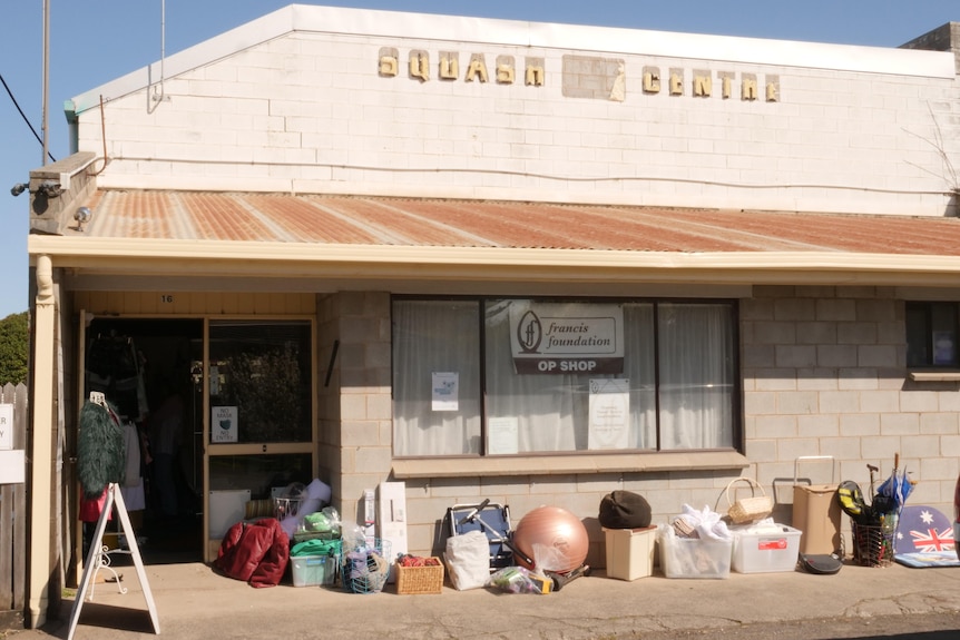 An old run-down squash court frontage re-purposed for an op-shop 