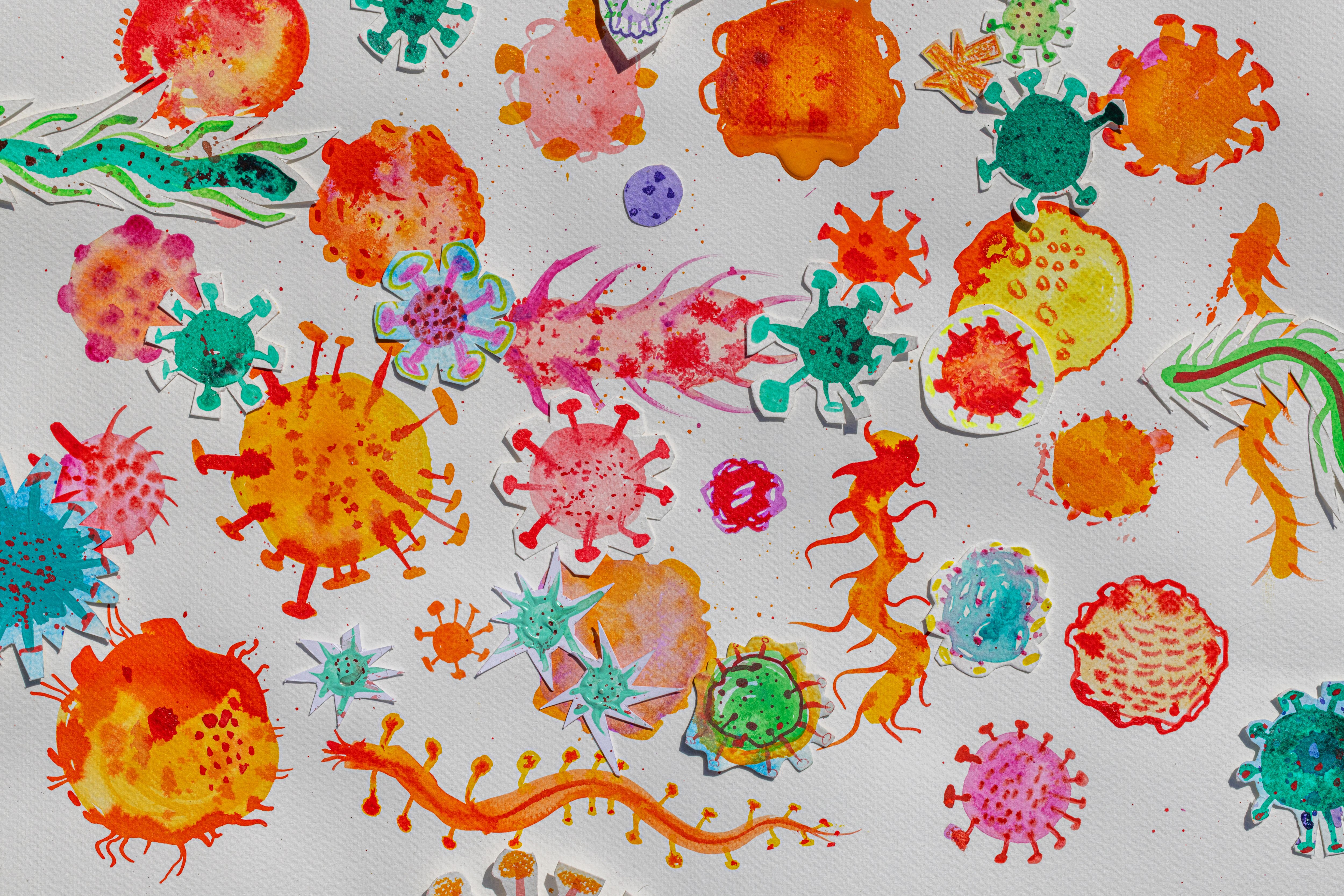 An illustration showcasing a vibrant micro world of microbes set against a clean, white background. 