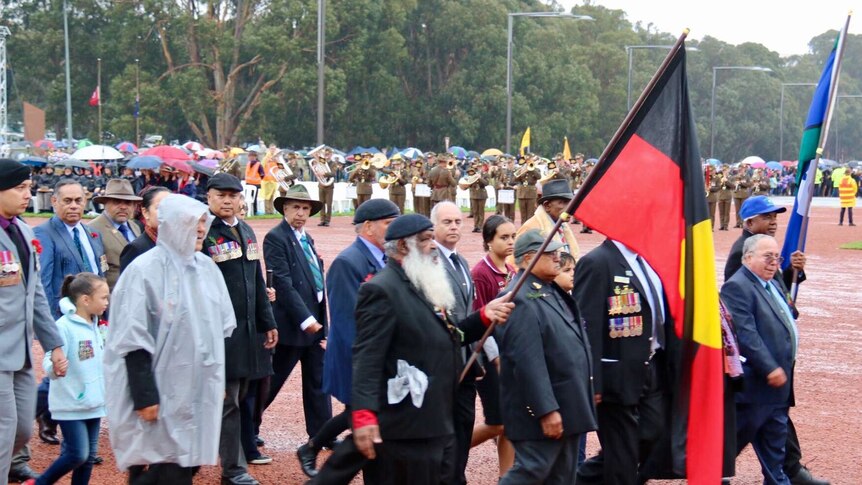 Aboriginal and Torres Strait Islander veterans lead march in Canberra.