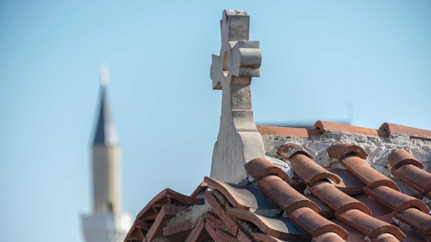 Church cross and mosque minaret