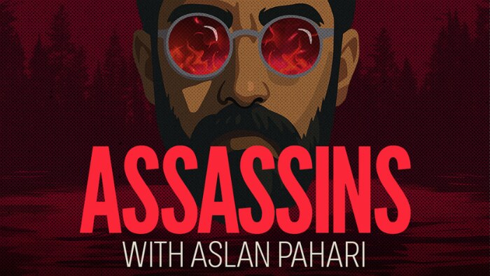 Assassins with Aslan Pahari. Illustration of Aslan Pahari wearing red glasses with flames reflected in the lens.