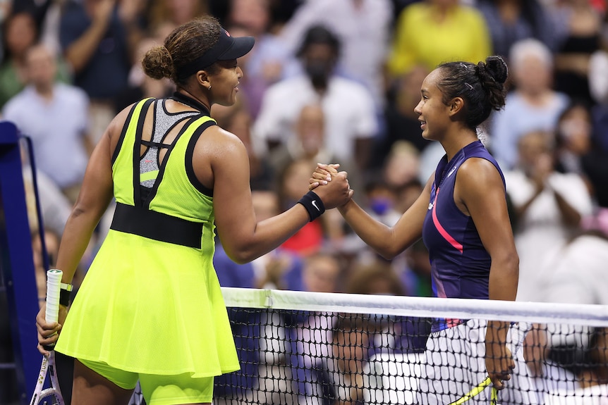 Female tennis players shaking hands after a match