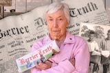 Broken Hill resident and subscriber to the Barrier Truth, Lyn Farquharson with archive photos of the newspaper