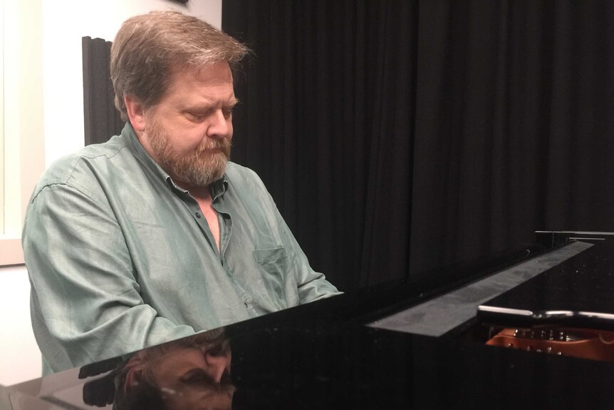 Composer Houston Dunleavy plays his piano