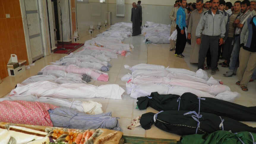 Bodies pile up after Syrian massacre