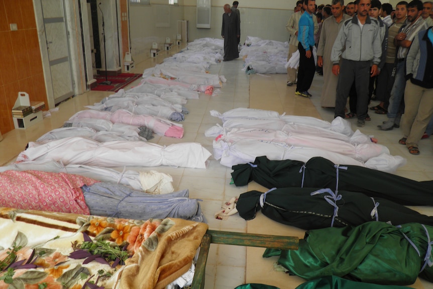 Bodies pile up after Syrian massacre