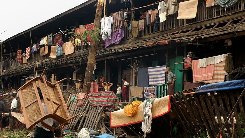 Death toll hits 22,500: Residents try and rebuild their houses after cyclone Nargis.