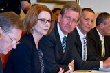 Julia Gillard sits with state and territory leaders at COAG