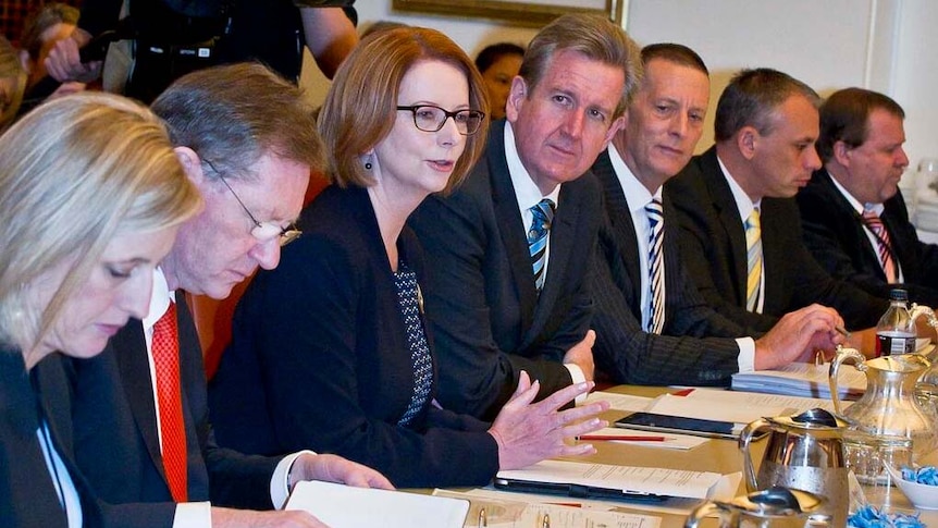 Julia Gillard sits with state and territory leaders at COAG