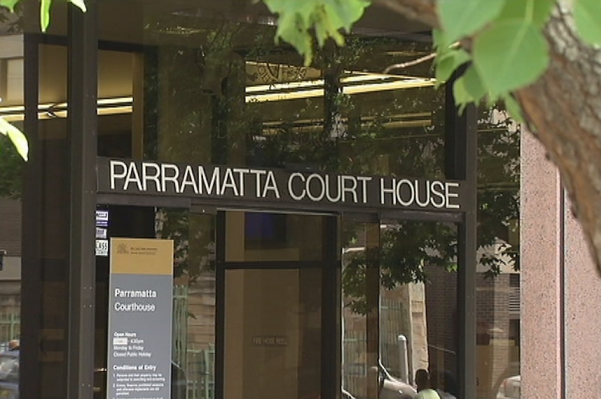 The words "Parramatta Court House" above the glass-framed entry to a building.