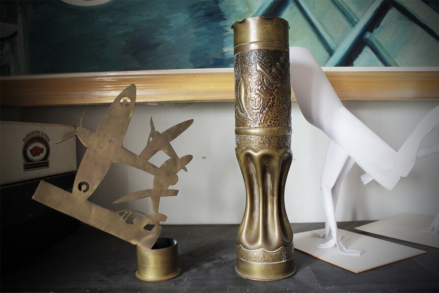 An 18 pound Belgian canon shell with trench art from the World War 1 era on display in Bob McRae's home.