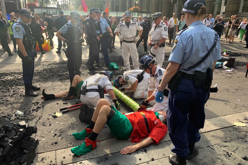 Police and climate protesters on the road