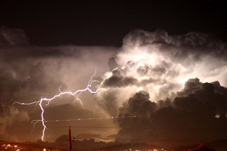 Lightning cracks from dark clouds.