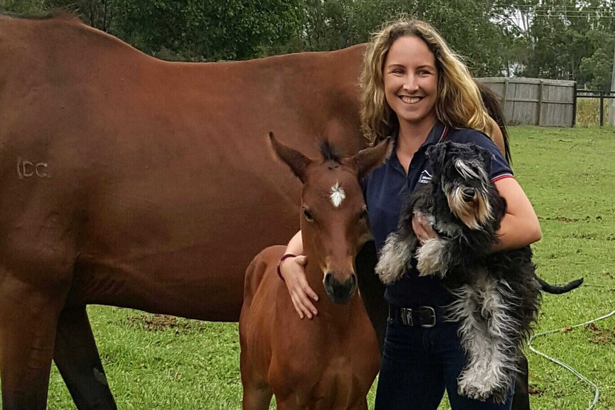 Louise Kennedy with a horse and a dog