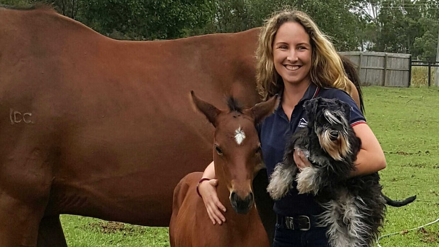 Louise Kennedy with a horse and a dog