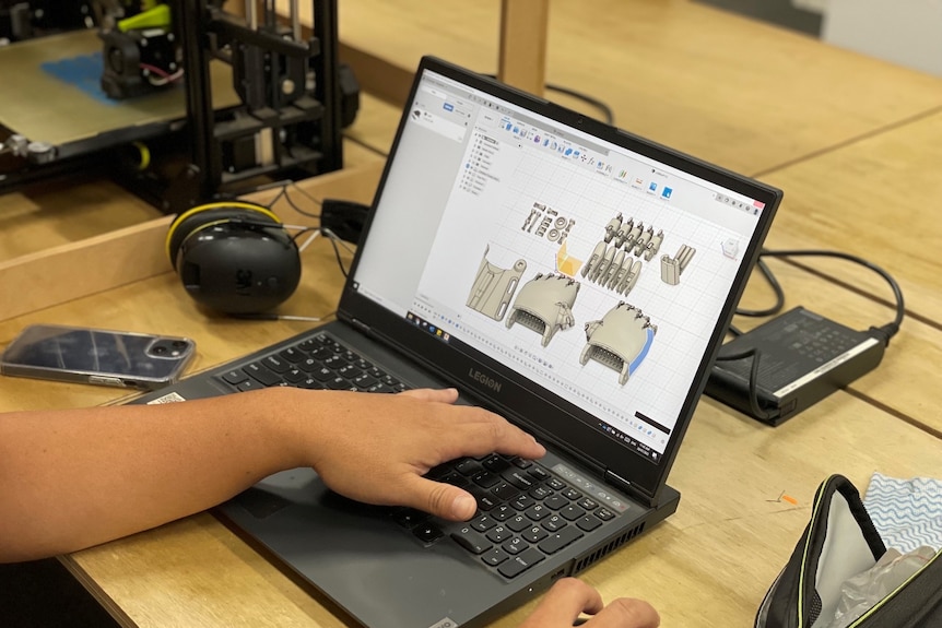 Plans for a prosthetic hand on a computer 