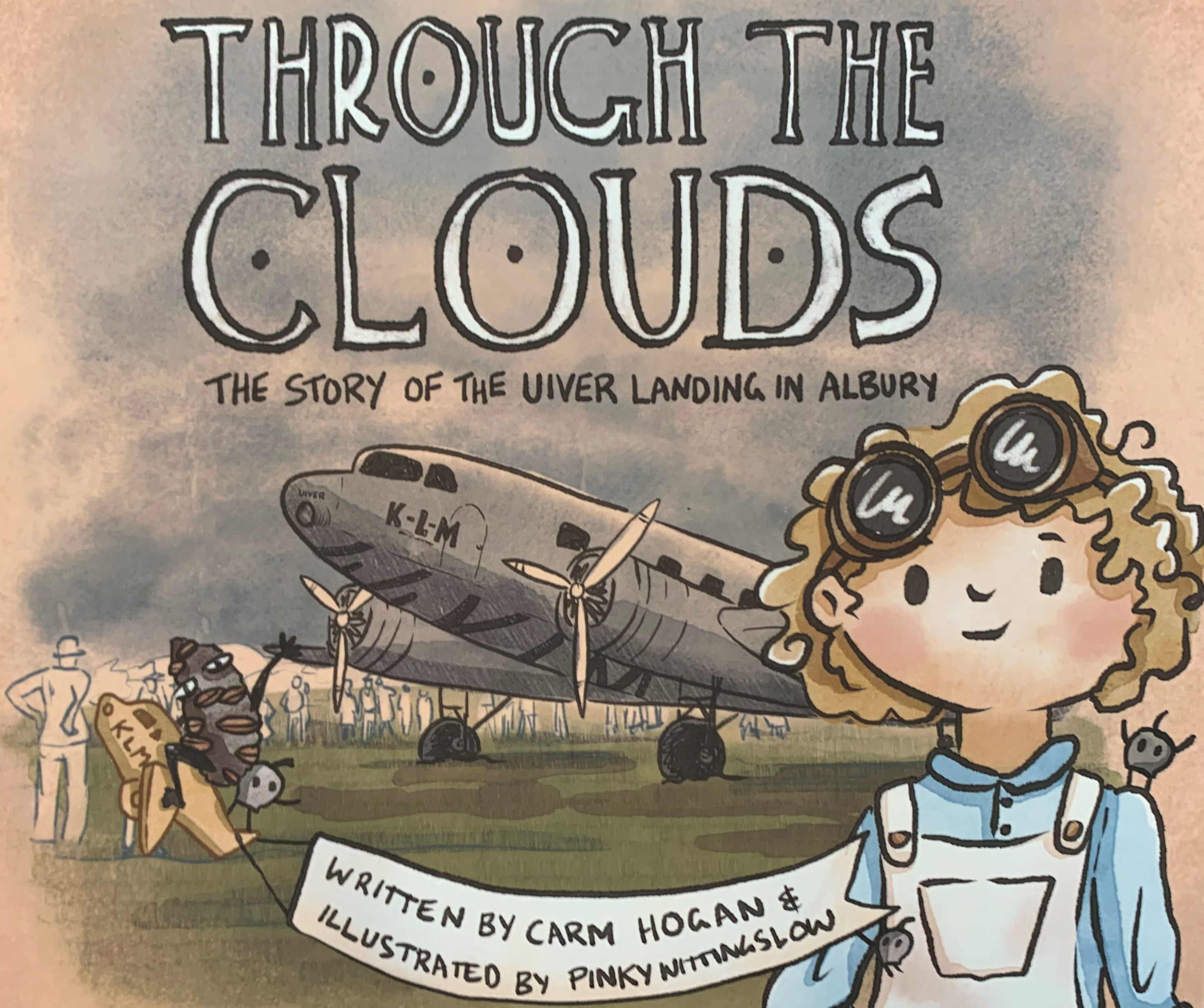 Front cover of the children's book Through the Clouds show six-year-old Whilhemenia standing in front of the grounded Uiver.