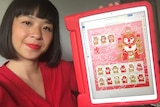 Chrissy Lau with her Year of the Tiger stamp design