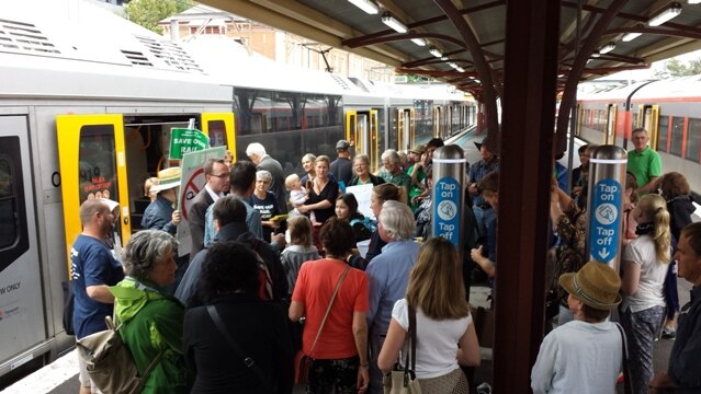 NSW Greens MP David Shoebridge addresses Save Our Rail protestors at Newcastle train station.