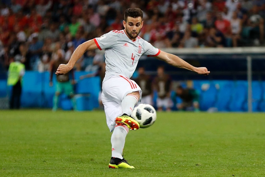 Spain defender Nacho strikes the ball on the half volley