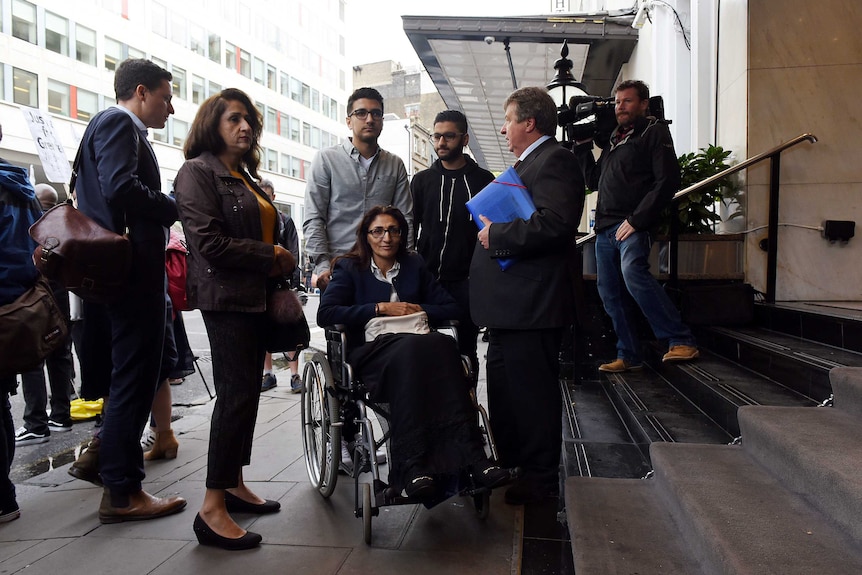 Survivor of the Grenfell fire Flora Neda and her family arrive at the Grenfell Tower public Inquiry.