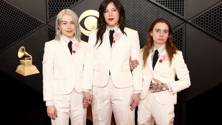  Phoebe Bridgers, Lucy Dacus and Julien Baker in matching white suits.