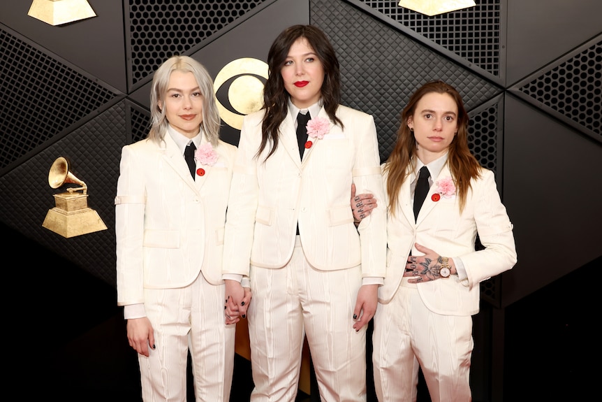  Phoebe Bridgers, Lucy Dacus and Julien Baker in matching white suits.