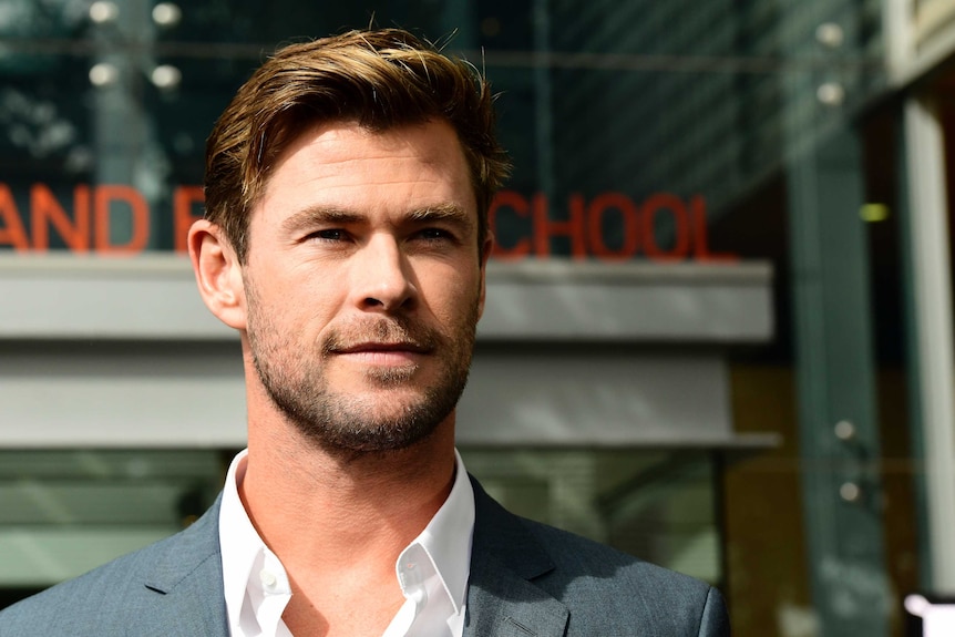 Chris Hemsworth stares into the camera.