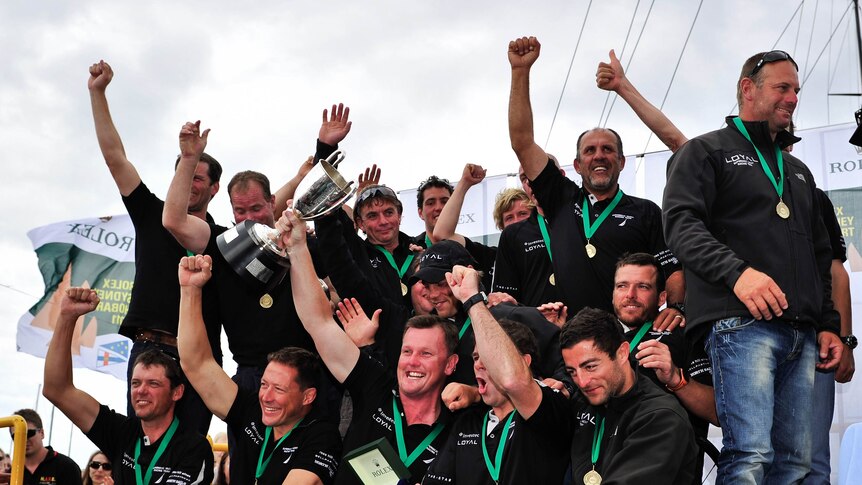 Finally celebrating: the Investec LOYAL crew after being presented with their trophy.