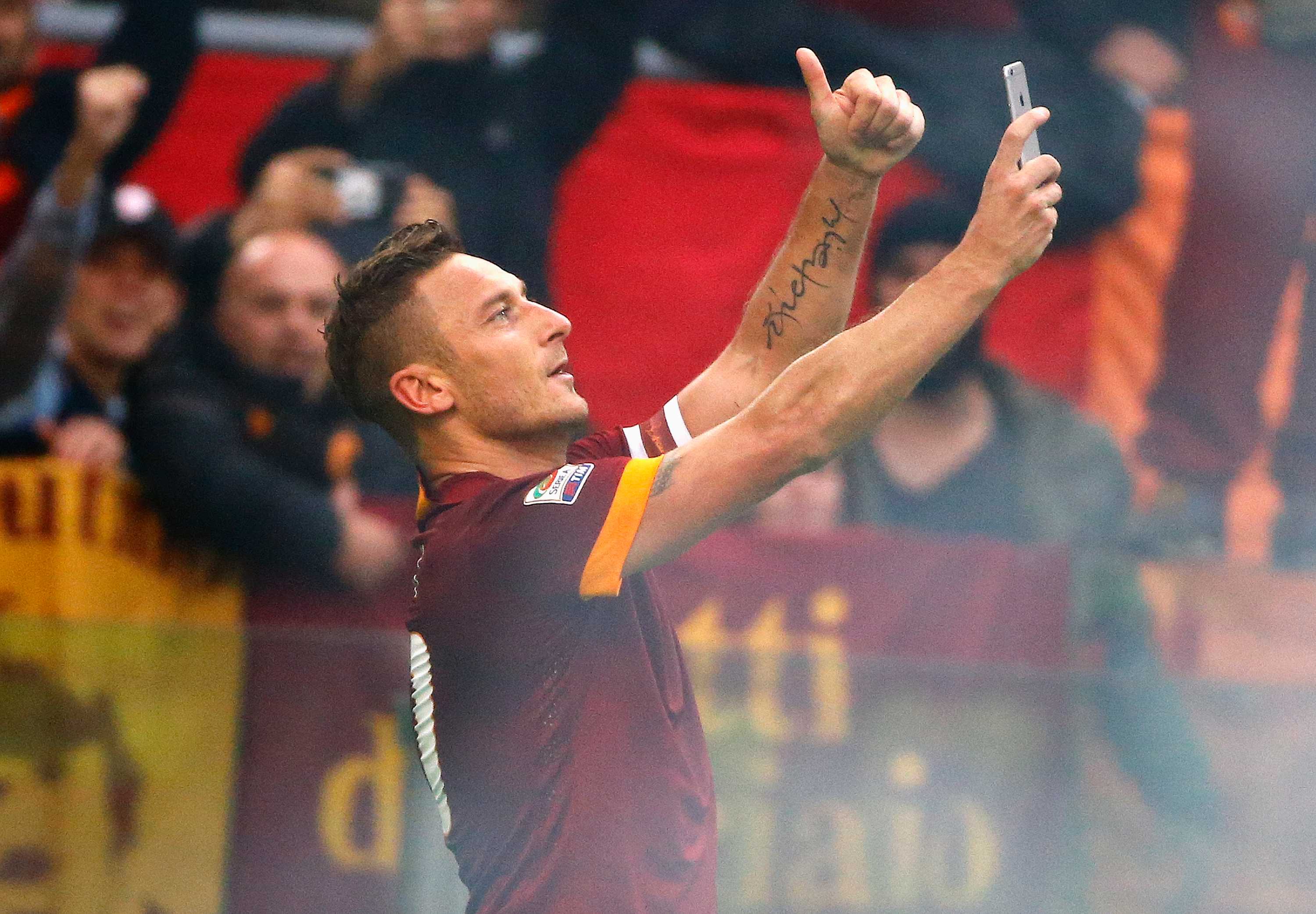 Francesco Totti celebrates with selfie after scoring two goals for AS